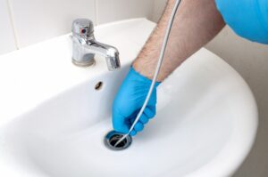 cleaning-a-bathroom-sink-drain-with-a-drain-snake