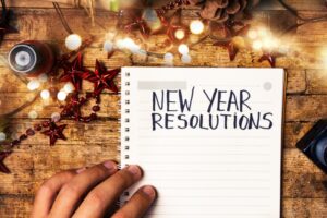 person-writing-a-list-of-new-year's-resolutions
