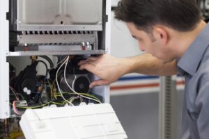 a-heating-technician-repairing-a-furnace